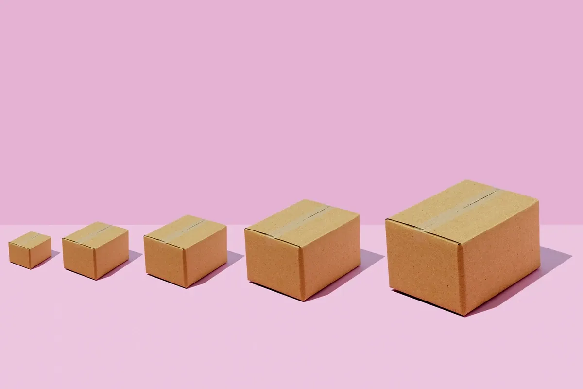 A series of boxes placed in a row in order from smallest to largest.